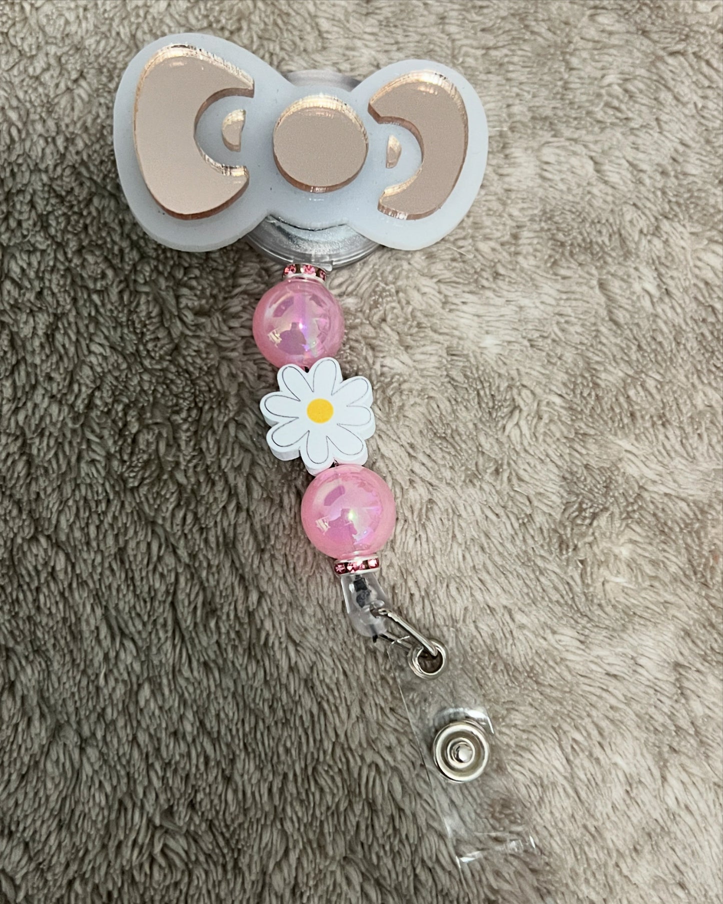 Hello Kitty bow badge reel
