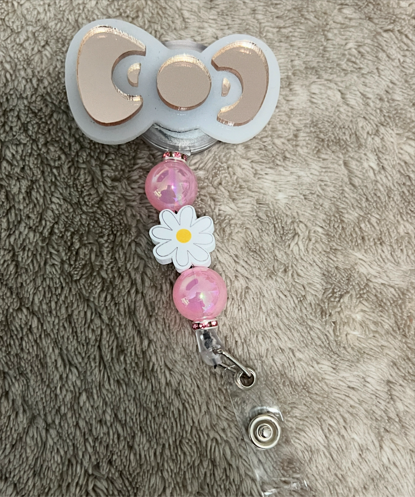 Hello Kitty bow badge reel
